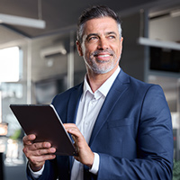 Image of man holding tablet