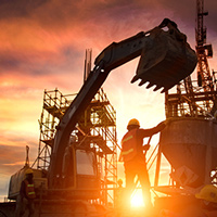 Image of crane with sunrise behind it