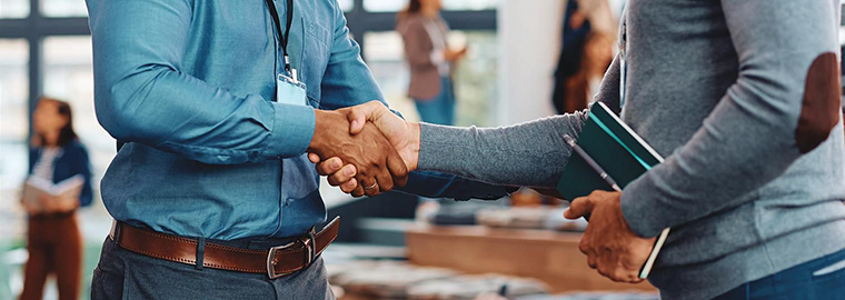 Two business men shaking hands