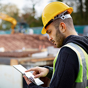 Construction worker looking at tablet