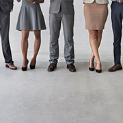 Cropped view of male and female legs in business wear