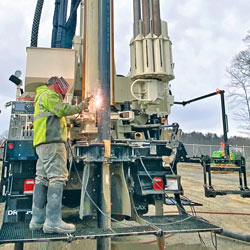 Man standing on drilling rig working